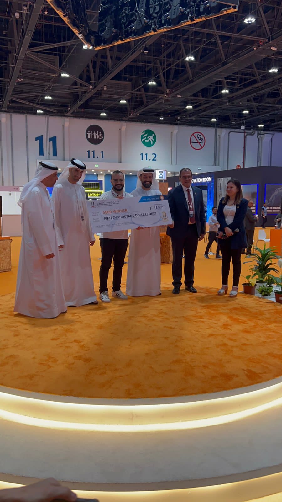Basheer Torayah receiving the AIM Conference 2023 award on stage